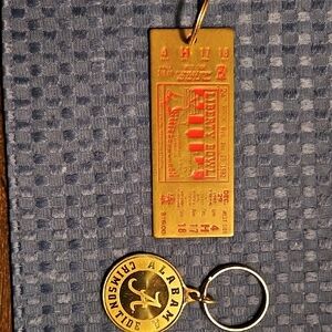 Lot Of 2-Alabama Keychains.1982 Liberty Bowl Brass Keychain + U of A Keychain